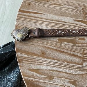 Belt with heart shaped pendent on front